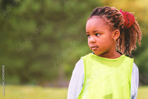 A close portrait of a sad young Afrian girl  photo