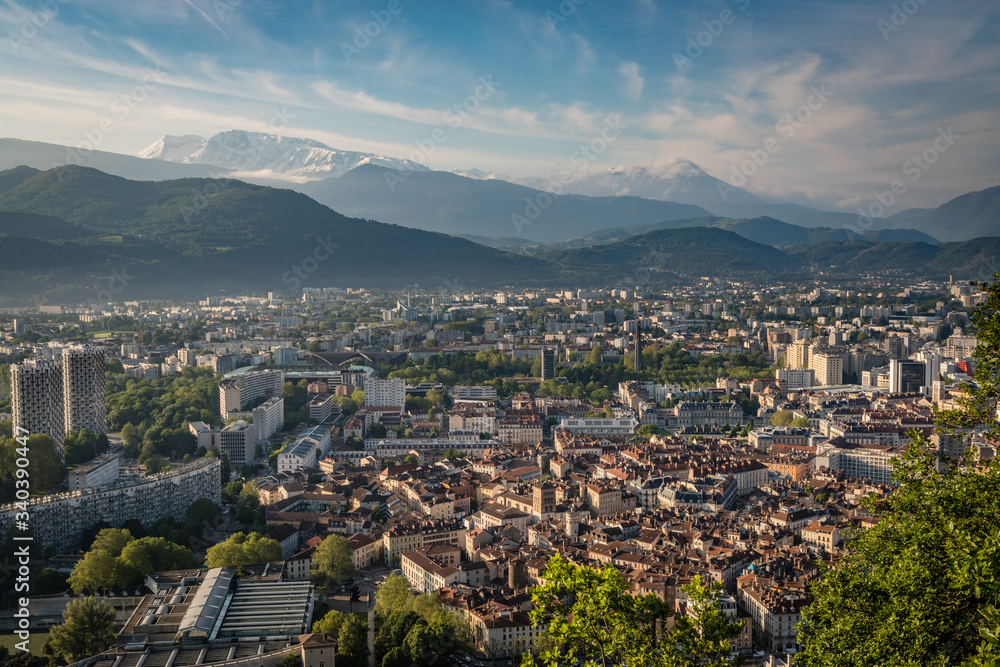 Bright sunny morning with the old section of Grenoble France and the French Alps in the background