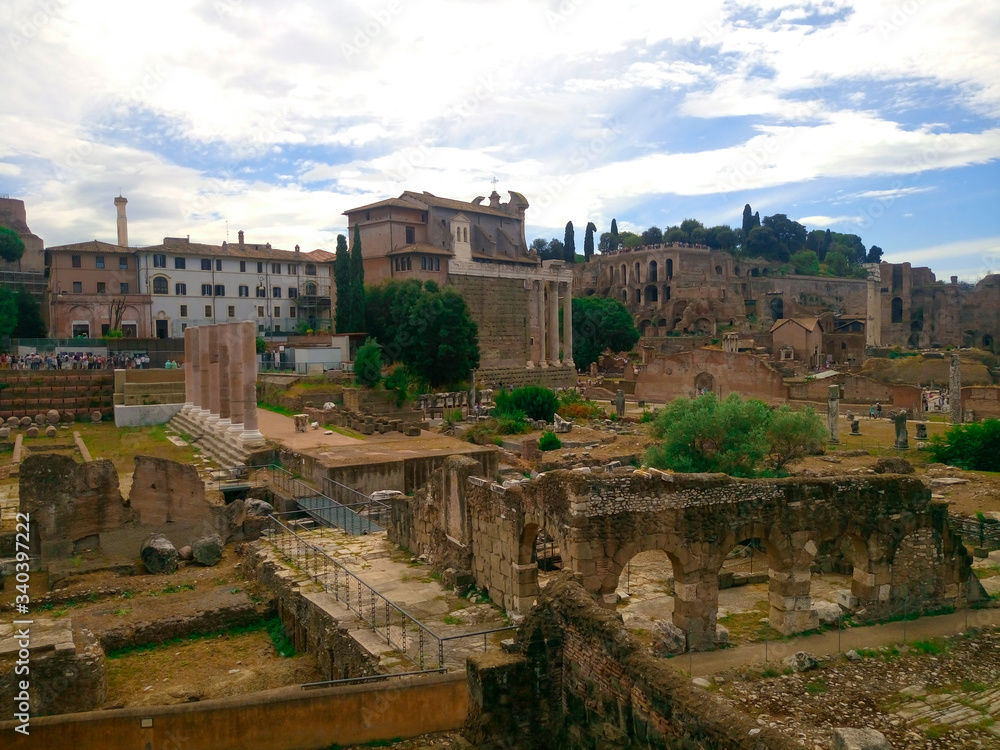 The Roman Forum in the center of Ancient Rome, together with the adjacent buildings. Italy