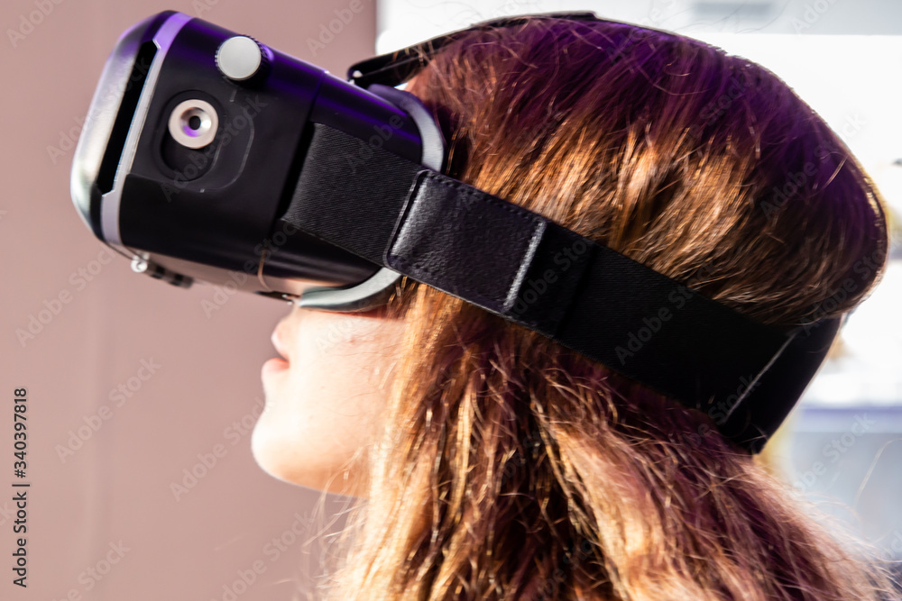 Fototapeta premium Girl wearing virtual reality glasses