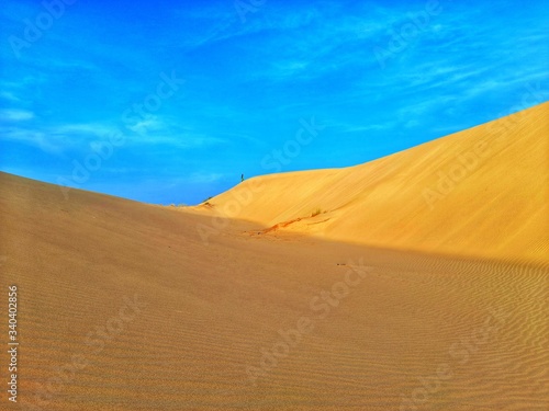 Walking in sand dunes on desert