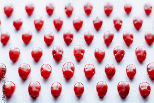 Fresh cherry tomatoes on a white background. Food isolate. Group of fresh tomatoes.