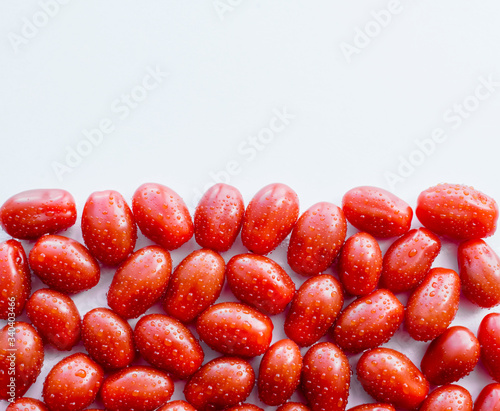 Cherry tomatoes in water droplets. Fresh vegetables. Red tomatoes in drops. Closeup