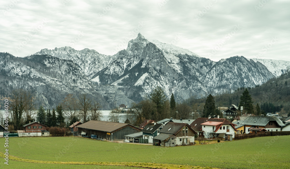 Small Austrian village by Traunsee lake with snow mountain Traunstein in Austria