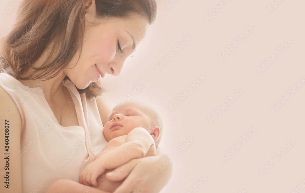 Mother and her Newborn Baby together. Love. Happy Mother and Baby kissing and hugging. Soft image of Beautiful Family. Maternity concept. Parenthood. Motherhood, adoption concept. On pink background - obrazy, fototapety, plakaty 