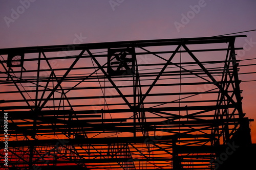 Photos Sunset in the background of a building skeleton