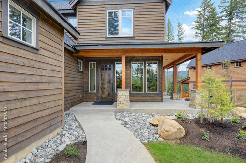 Front porch of the rustic classic Northwest new home. © Iriana Shiyan