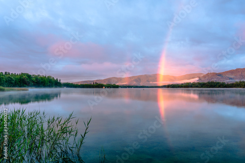 Morning rainbow in the lake (Lake of Banyoles, Catalonia, Spain)
