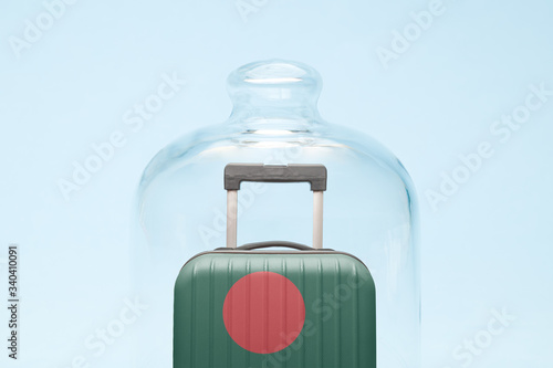 Luggage in isolation under glass cover covid-19 Bangladesh tourism abstract.