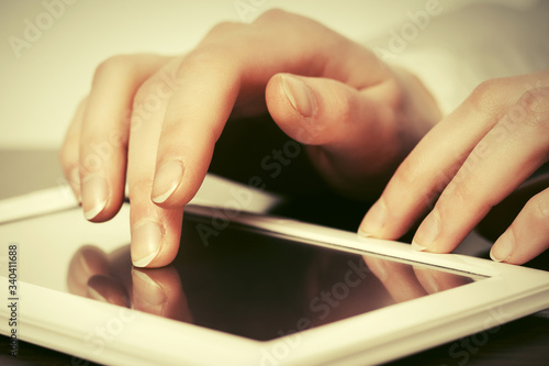 Woman using tablet computer