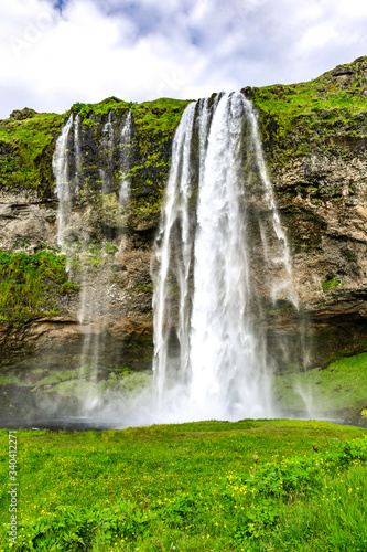 The Seljalandsfoss waterfall in south Iceland during a sunset