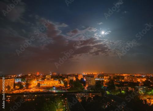 Cityscape of Full moon cloudy night over Wroclaw city