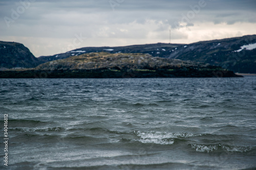 View of the sea and mountains in cloudy weather. Barents Sea Russian North.