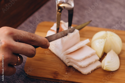 slice a piece of Ukrainian pork fat and serve on a wooden board