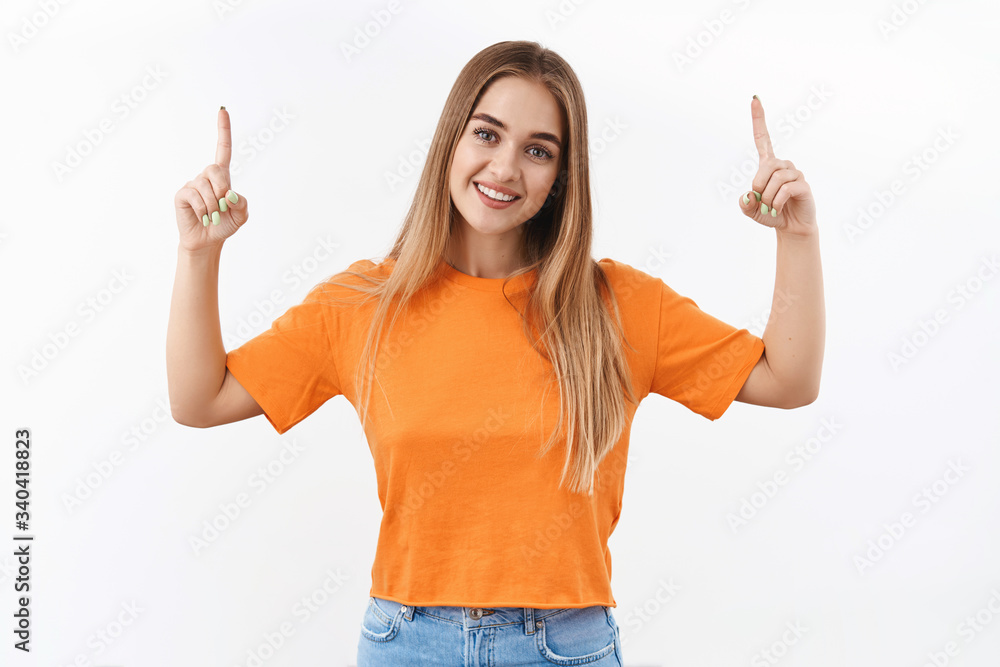 Lovely blonde girl inviting to click link, follow website to get info, pointing fingers up and smiling camera, recommend good promo discount, special offer on company banner, white background Lovely blonde girl inviting to click link, follow website to get info, pointing fingers up and smiling camera, recommend good promo discount, special offer on company banner, white background