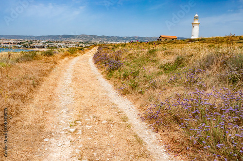Cyprus. Pathos. White Lighthouse. Lighthouse on the Mediterranean Sea. Panorama of the Cyprus coast. Lighthouse near the Paphos Archaeological Park. Excursions in Paphos. Cyprus Tourism. Scenery