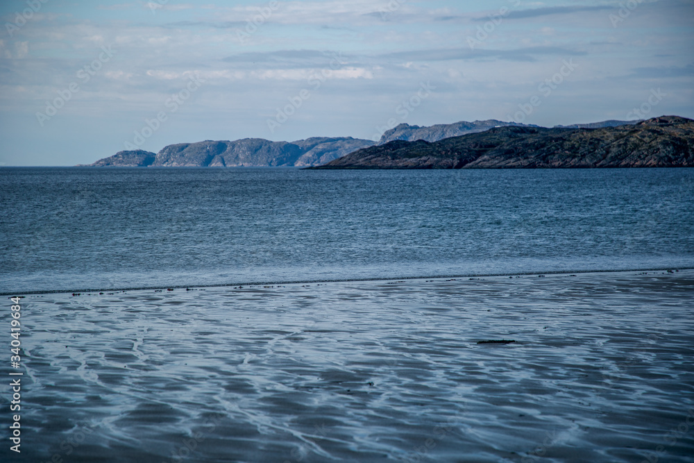 View of the blue sea and the cliffs in the distance. Barents Sea Murmansk region.