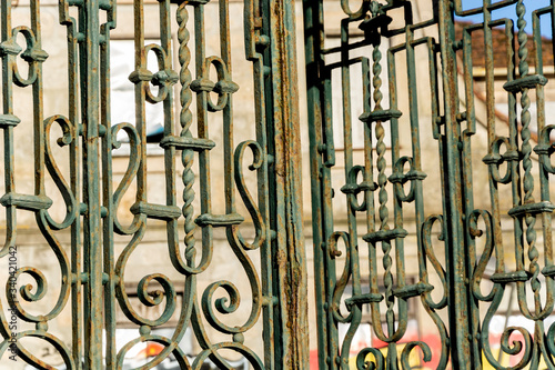 Vintage rusty iron gate, of a church. Green old iron gate. Porto