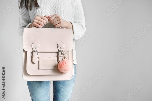 Beautiful fashionable girl with a handbag
