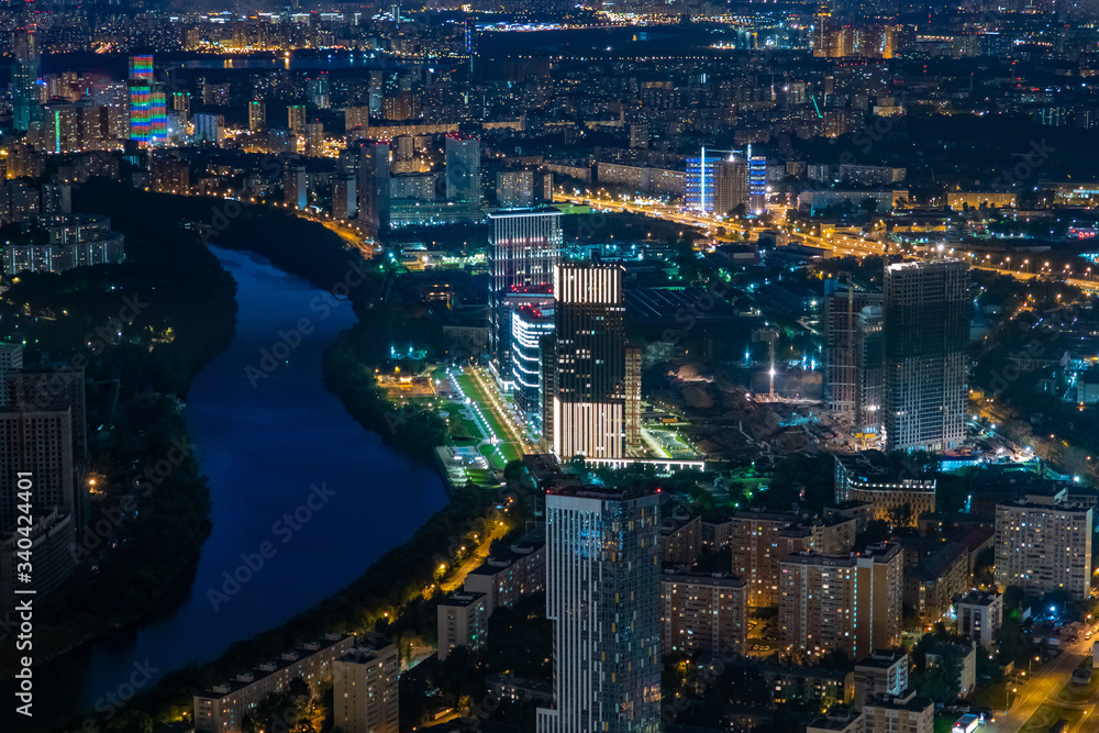 Moscow. Russia. Evening in the Russian capital. Moscow river in the evening. Panorama of evening Moscow from a height. Evening city landscape. Big city at night. The city is lit with many lights.