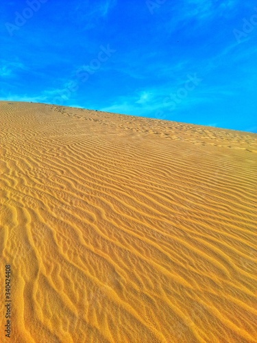 Walking in sand dunes on desert