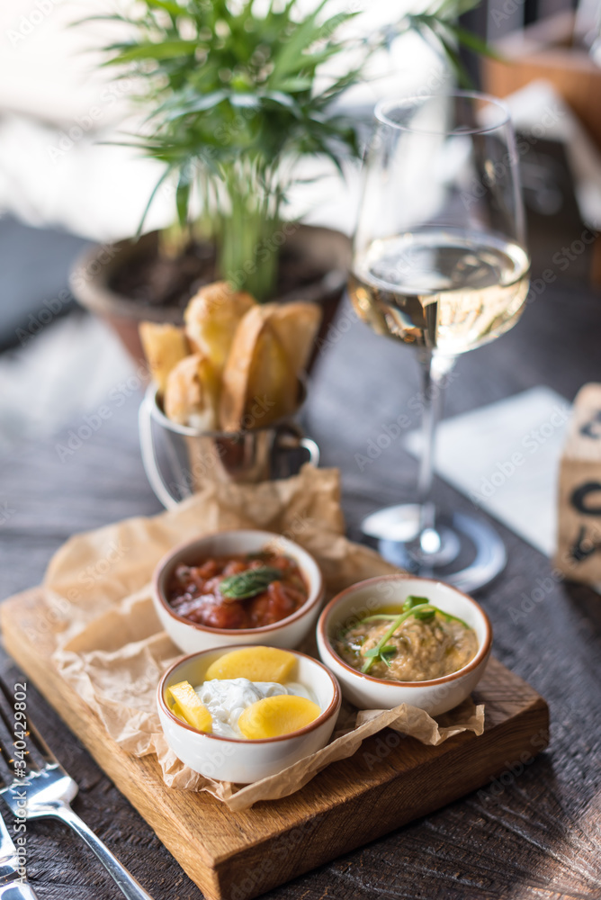 Roasted Aubergine Dip, Tomato Basil Sauce and Cream Cheese with Fruit. Assorted Appetizers and Wine Roasted Aubergine Dip, Tomato Basil Sauce and Cream Cheese with Fruit. Assorted Appetizers and Wine