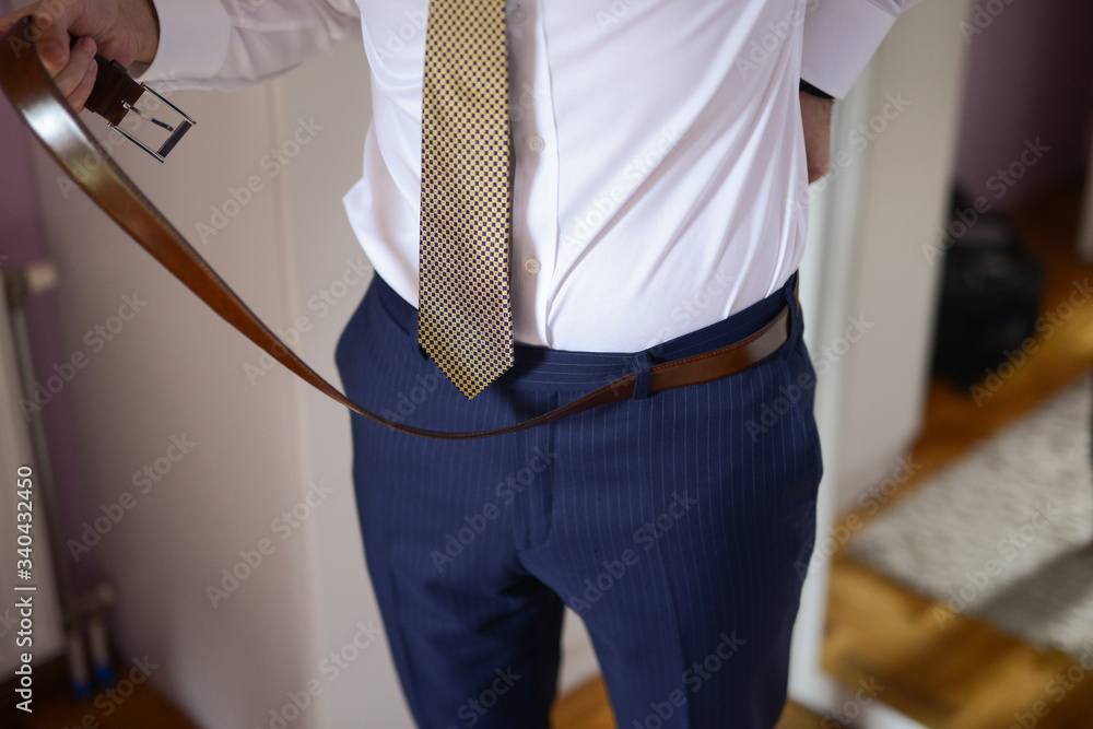 Businessman preparing for business. Suit and fashion Businessman preparing for business. Suit and fashion