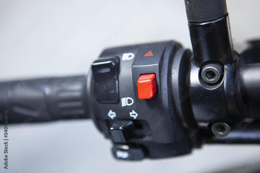 Macro detail of light and horn switches in a naked motorcycle Macro detail of light and horn switches in a naked motorcycle