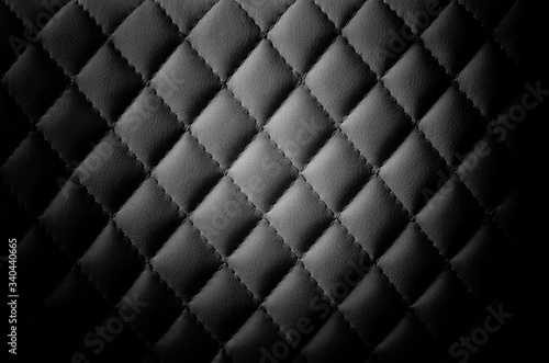 Black leather background. Leather stitched with threads © Igor Ushakov