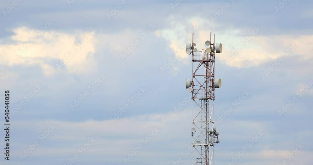 Interval timer shooting . repeater.GSM tower . phone tower with blue sky and cloudy background.ADSL, GPRS, LTE.3G. 4G. 5g. RS 1800.CDMA.Cellular tower station for wireless telecommunication technology Interval timer shooting . repeater.GSM tower . phone tower with blue sky and cloudy background.ADSL, GPRS, LTE.3G. 4G. 5g. RS 1800.CDMA.Cellular tower station for wireless telecommunication technology