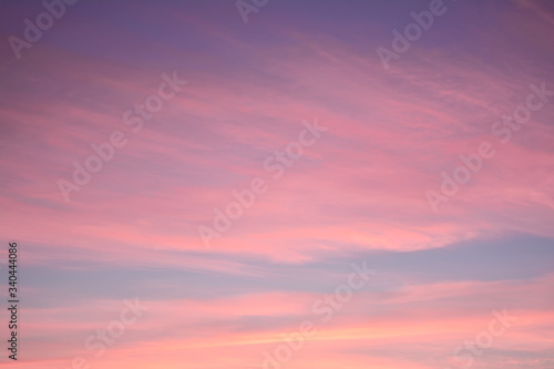 Blue sky at sunset with bright stains of orange and pink. Concept landscape, abstraction. © Chetgal 