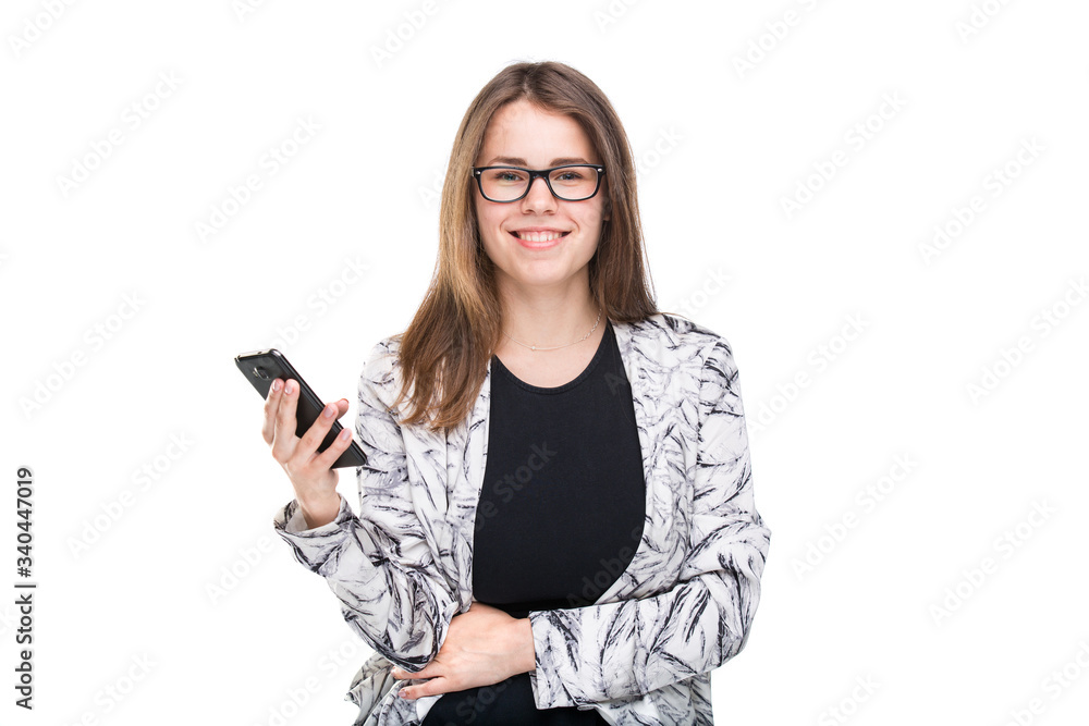 Portrait business woman in eyeglasses holding smartphone over white background. Using phone. Young businesswoman looking at mobile phone. business and technology concept Portrait business woman in eyeglasses holding smartphone over white background. Using phone. Young businesswoman looking at mobile phone. business and technology concept