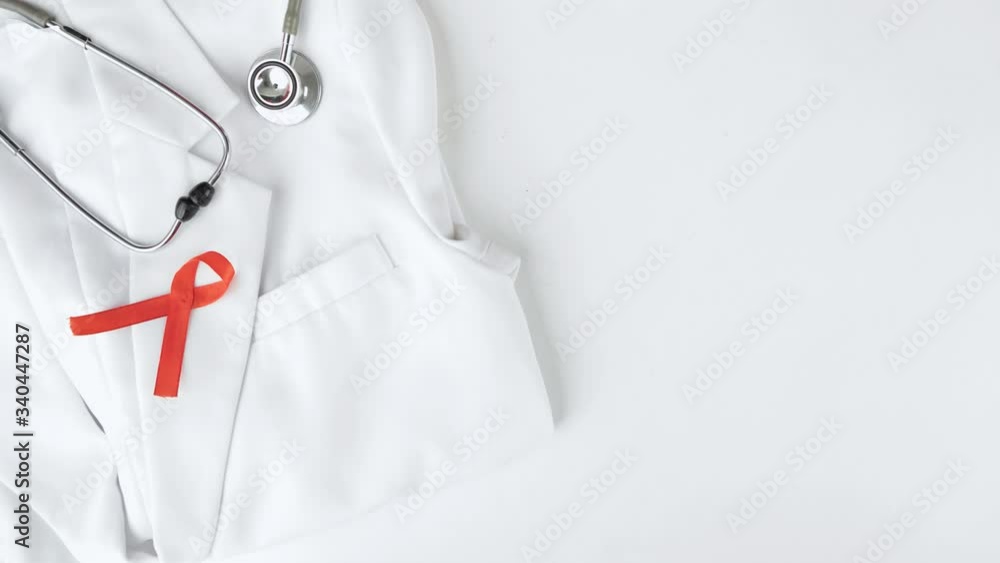 Stop motion animation of a red ribbon out and in from a pocket of doctor coat. World Aids Day concept Stop motion animation of a red ribbon out and in from a pocket of doctor coat. World Aids Day concept