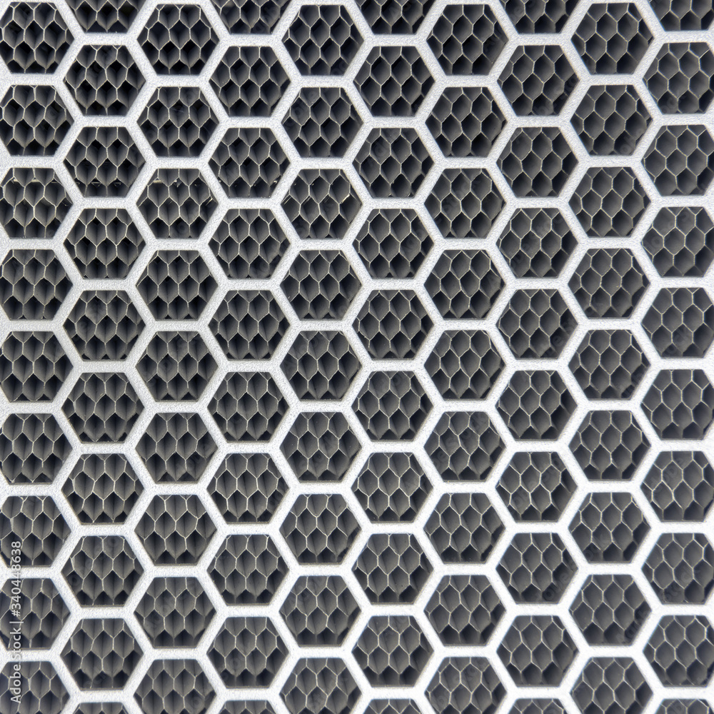 Background metal grilles with hexagonal holes