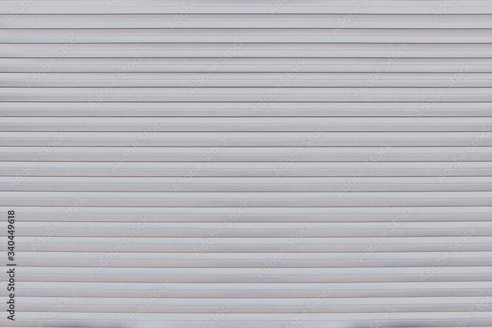 Background of a wall of smooth metal stripes Background of a wall of smooth metal stripes