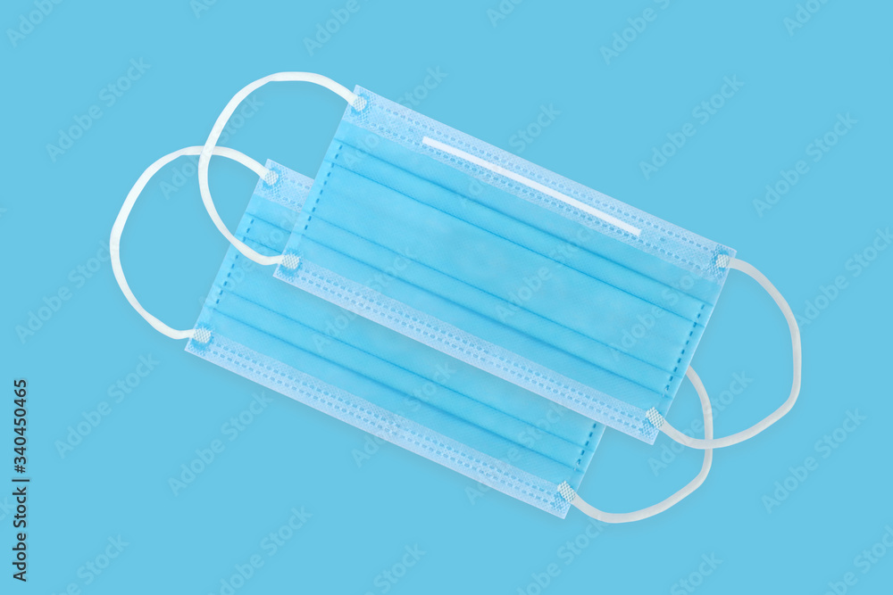 Medical mask isolated on blue background.