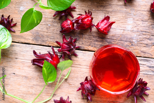 Roselle juice on wooden background, herbal organic tea for good healthy