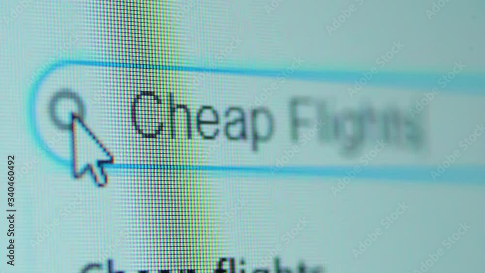 Computer monitor with Cheap Flight Tickets text on browser tab. Search Engine Concept. Shot in 4k resolution Computer monitor with Cheap Flight Tickets text on browser tab. Search Engine Concept. Shot in 4k resolution
