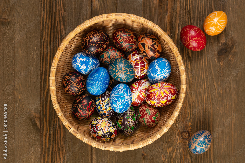 Set of Easter eggs painted in traditional Eastern European style with a floral/geometric design in a basket. Set of Easter eggs painted in traditional Eastern European style with a floral/geometric design in a basket.