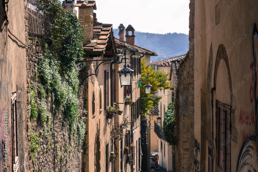 Typical street in Arezzo in a sunny day, Tuscany, Italy.
