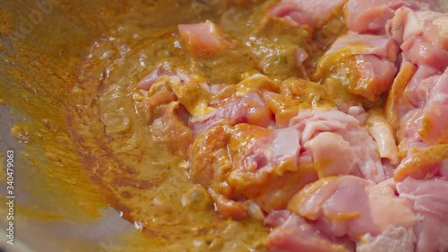 A person is cooking a Thai Spicy Green Curry with Chicken in the kitchen photo