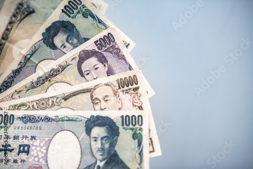 Japanese yen banknotes on grey background.  photo