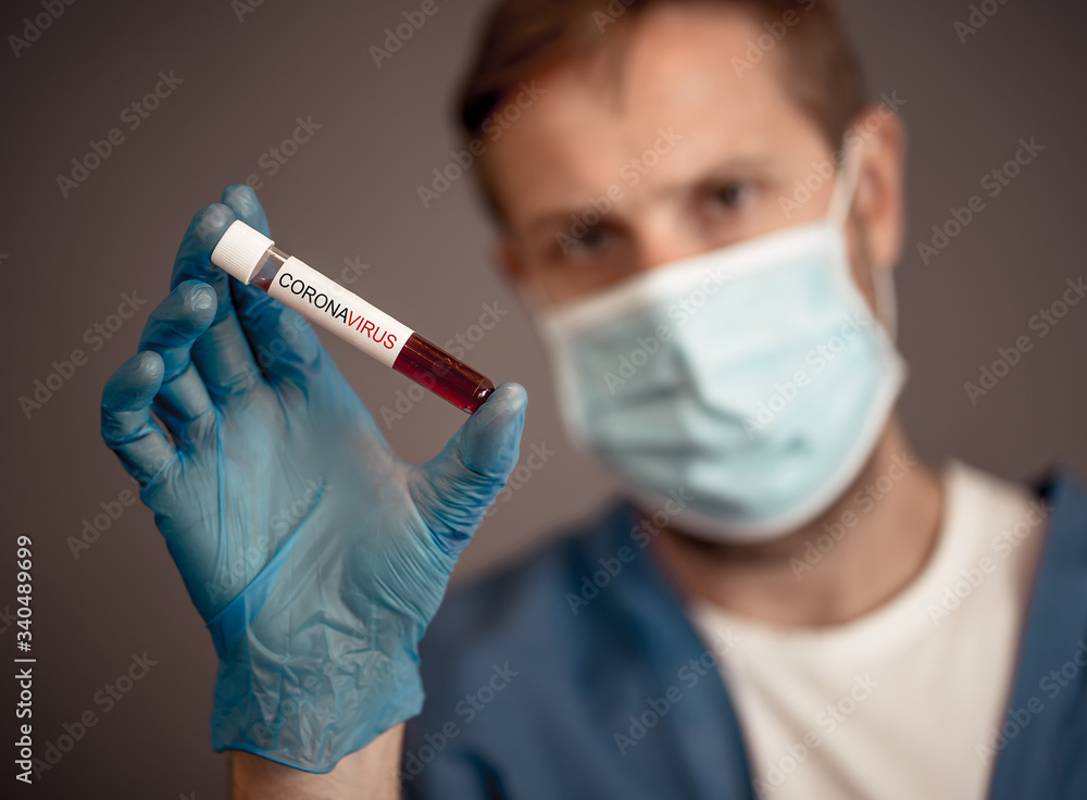Scientist testing coronavirus positive blood sample researching for COVID-19 antibodies and vaccine Scientist testing coronavirus positive blood sample researching for COVID-19 antibodies and vaccine