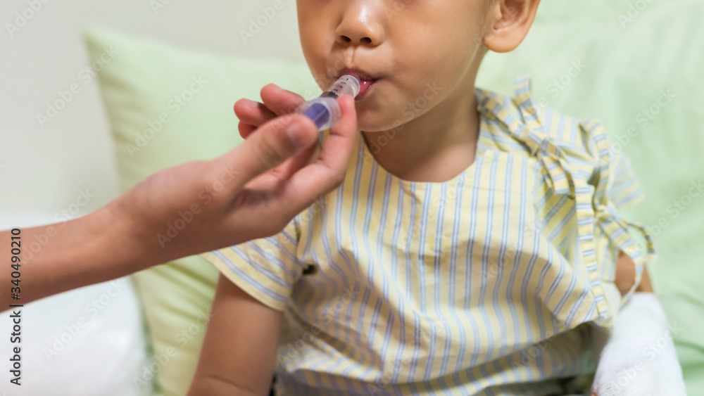 boy patient take medicine on syringe boy patient take medicine on syringe