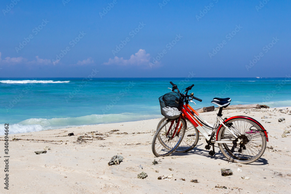 Bicycles on a white sand beach
