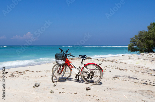 Bicycles on a white sand beach