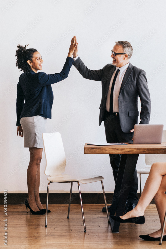 Obraz premium Successful businesspeople doing a high five
