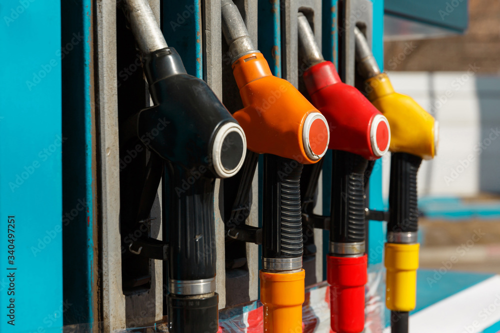 Service gas station with fuel. Refueling gun of a gasoline pump. Petrol station. Service gas station with fuel. Refueling gun of a gasoline pump. Petrol station.