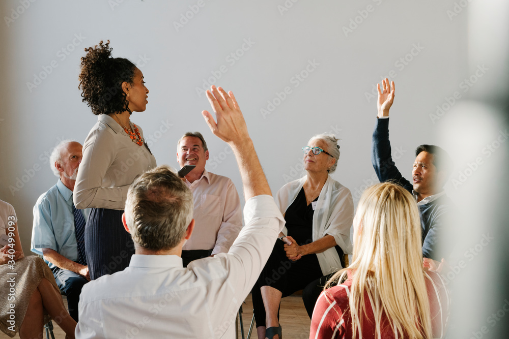 © rawpixel.com - Young businesswoman talking to a crowd