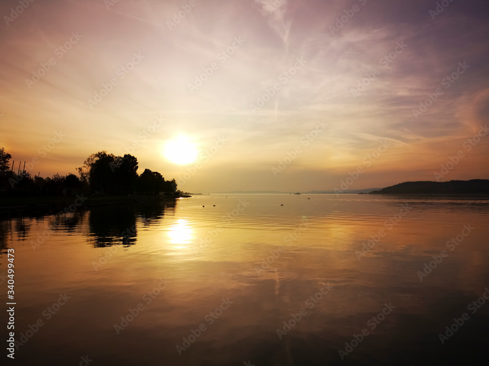 Zamárdi beach with sunset and ferry, Hungary Zamárdi beach with sunset and ferry, Hungary